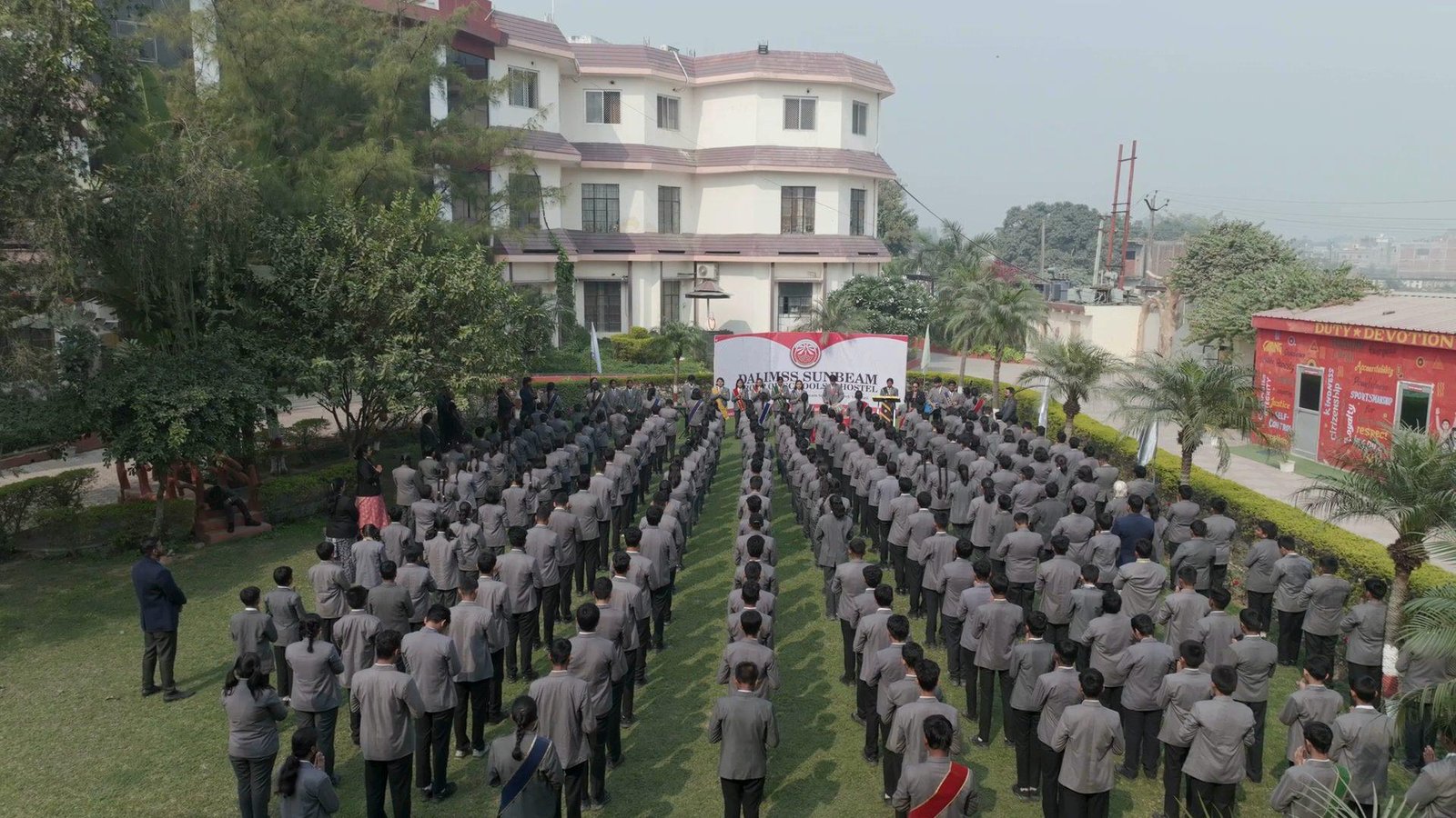 Students at morning assembly on the lawn at Dalimss Sunbeam Rohania, seen from a drone