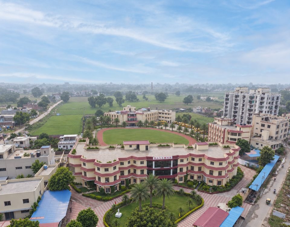 The main building at Dalimss Sunbeam Rohania across the playing field